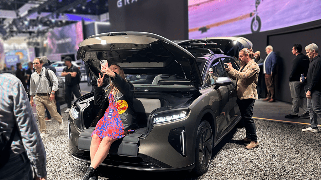 Alanis King of Cars & Bids fame taking a selfie in the frunk of a Lucid Gravity SUV